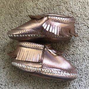 Copper Minnetonka leather moccasins size 3